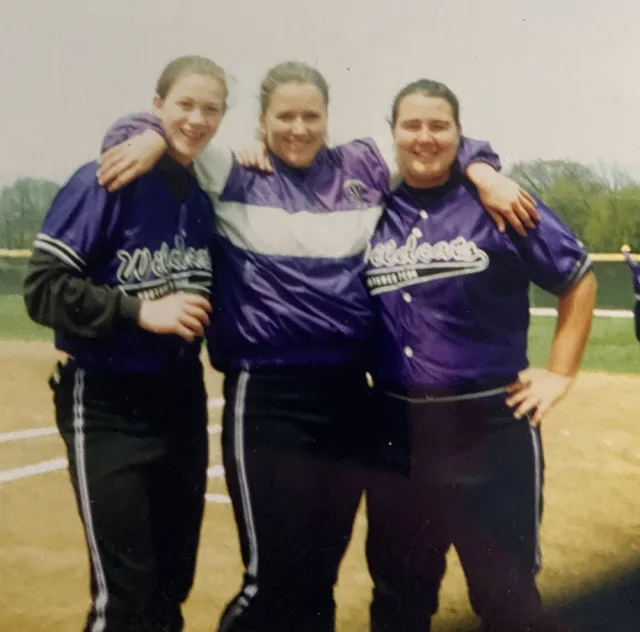 Tracy, on the left, with two Northwestern softball teammates
